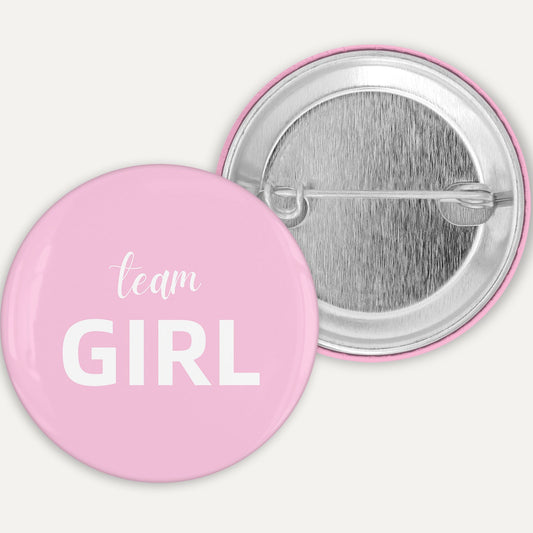 Pink button with 'team GIRL' text on a white background