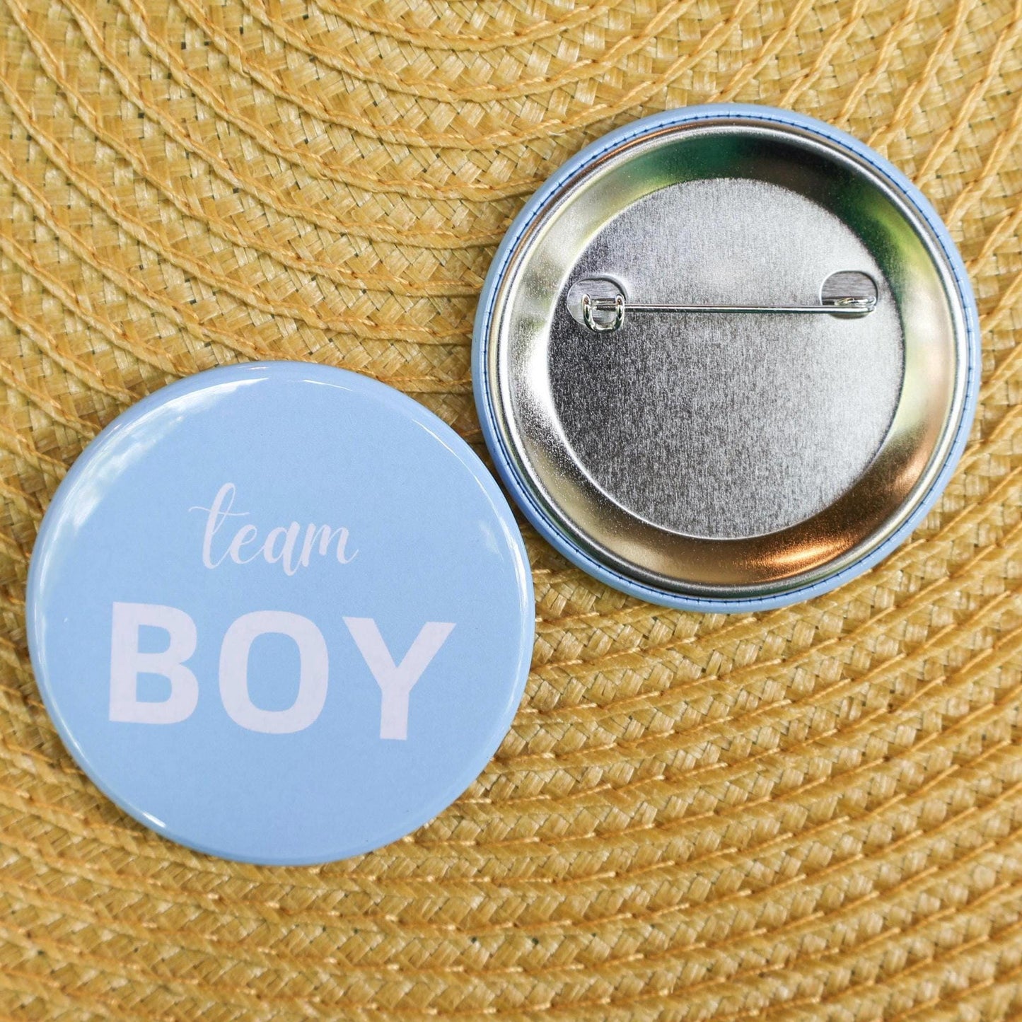 Close up team boy pin. Baby blue pin front and back. perfect gender reveal game and favor