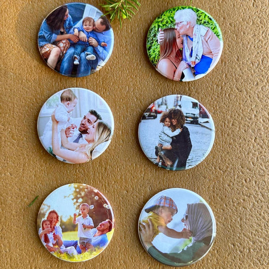 Set of circular photo magnets on a brown surface