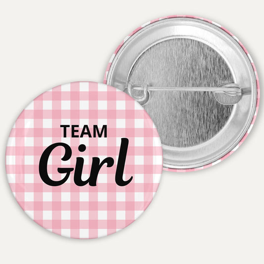 Button badge with 'Team Girl' text on a pink and white checkered background