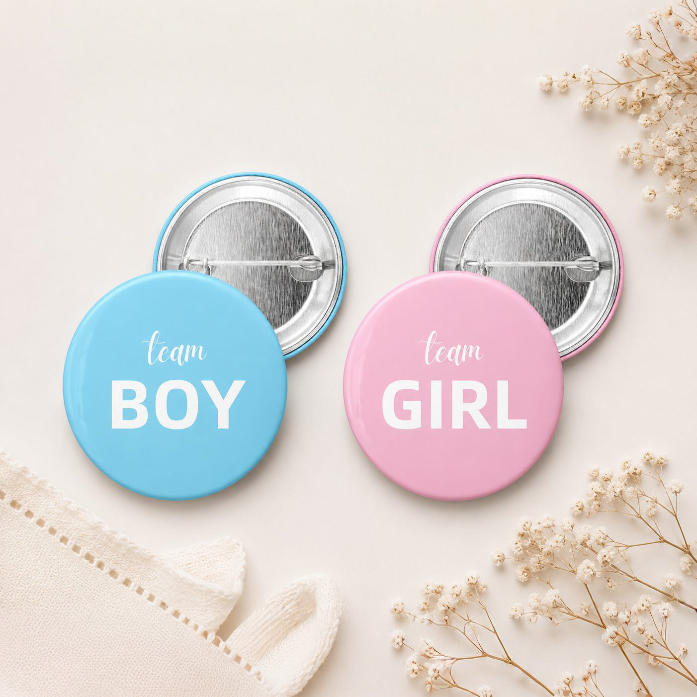 Two buttons, one blue with 'team BOY' and one pink with 'team GIRL', on a light background.