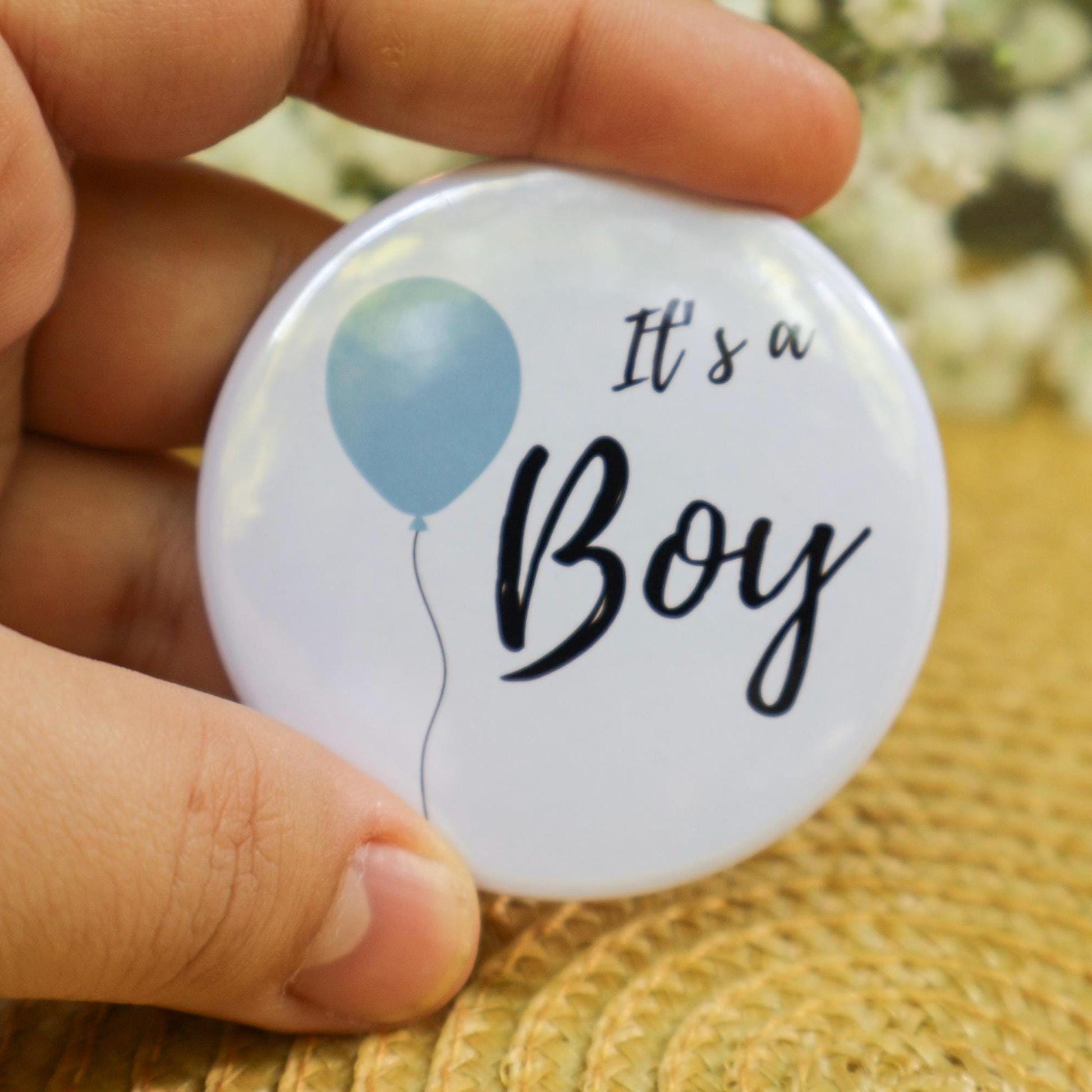 It's a boy pin with baby blue balloon. Gender reveal game favor and keepsake