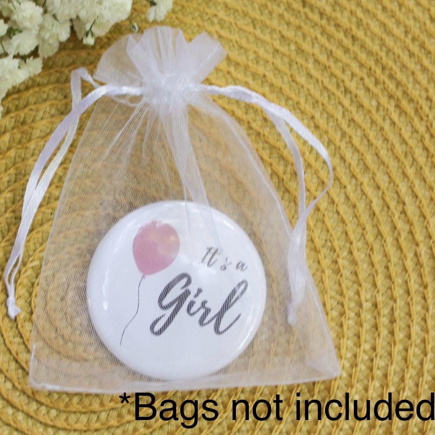 It's a girl button pin in a bag perfect baby shower guest keepsake.