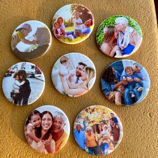 Collection of round photo magnets featuring various family moments on a textured surface.
